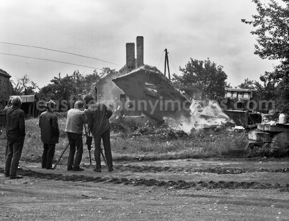 Lohsa: Rubble and debris on the construction site for demolition work on the remains of old multi-family houses for the creation of a brown coal mine in Lohsa, Saxony in the area of the former GDR, German Democratic Republic. Cameraman Franz Ritschel filming for the movie Struga - Pictures of a Landscape