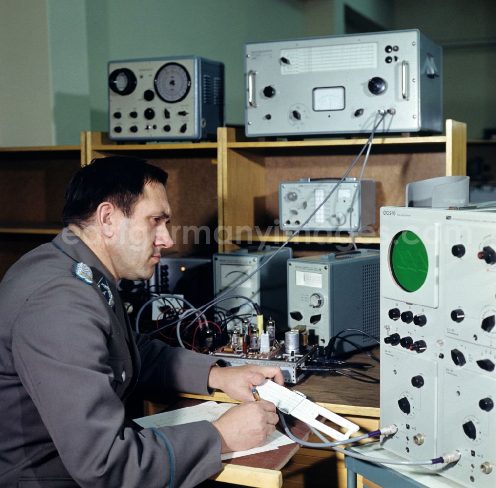 GDR photo archive: Dresden - Lieutenant Colonel of the Air Force at work at a test station for radio measuring technology in the National People's Army NVA office in Dresden, Saxony in the territory of the former GDR, German Democratic Republic