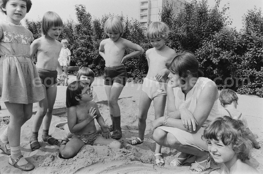 Berlin: Play and fun with small children supervised by a teacher in a kindergarten in Rosenfelder Ring in Berlin East Berlin in the area of the former GDR, German Democratic Republic