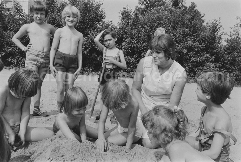 GDR image archive: Berlin - Play and fun with small children supervised by a teacher in a kindergarten in Rosenfelder Ring in Berlin East Berlin in the area of the former GDR, German Democratic Republic