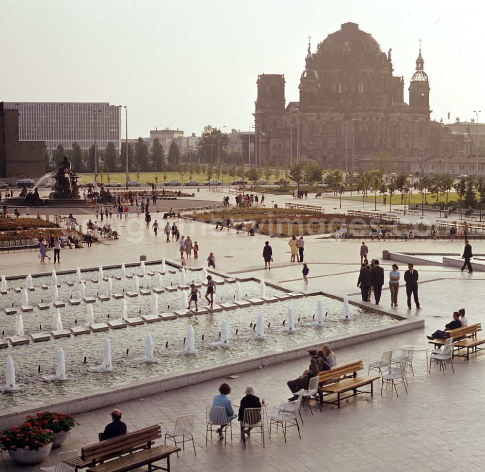 GDR image archive: Berlin - Popular water feature - fountain Neptunbrunnen with a view of the Berlin Cathedral on the Alexanderplatz in Berlin East Berlin on the territory of the former GDR, German Democratic Republic