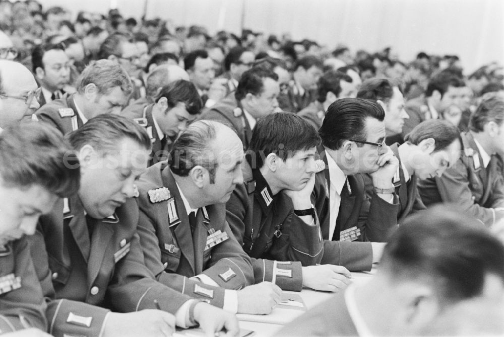 GDR image archive: Potsdam - Soldier between a colonel and an admiral of the Peoples Navy as members of the NVA National Peoples Army at the delegate conference in the Kremlin on the Brauhausberg in Potsdam, Brandenburg in the territory of the former GDR, German Democratic Republic
