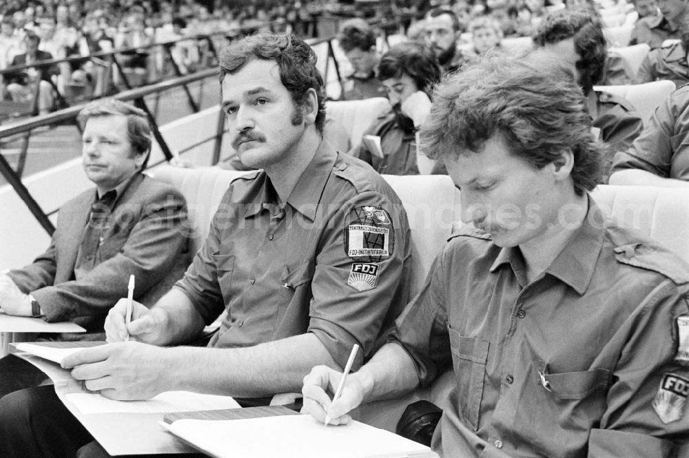 GDR photo archive: Berlin - Delegates during the meeting in the Great Hall of the Palace of the Republic on the occasion of the 7th Building Conference in the Mitte district of East Berlin in the territory of the former GDR, German Democratic Republic