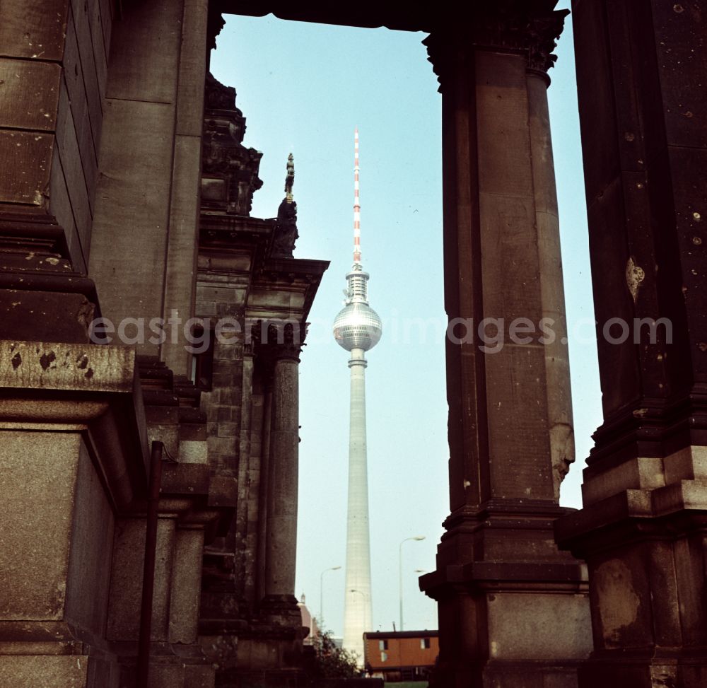 GDR photo archive: Berlin - Cathedral - facade and roof of the sacred building Berlin Cathedral with the television tower in the background on the street Am Lustgarten in the Mitte district of Berlin East Berlin on the territory of the former GDR, German Democratic Republic