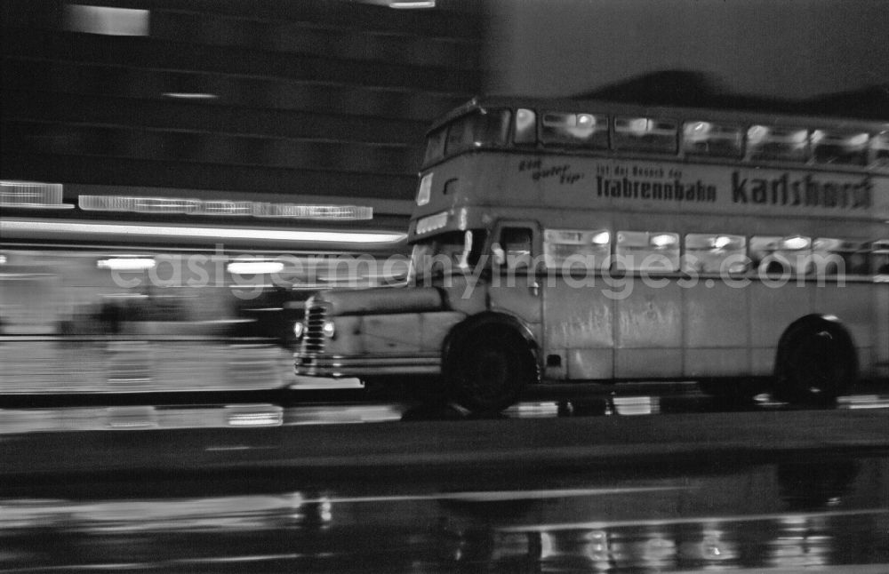 Berlin: Passenger bus as a double-decker bus - designed for night-time and rainy traffic in local transport on the street Unter den Linden in the Mitte district of Berlin East Berlin in the area of the former GDR, German Democratic Republic