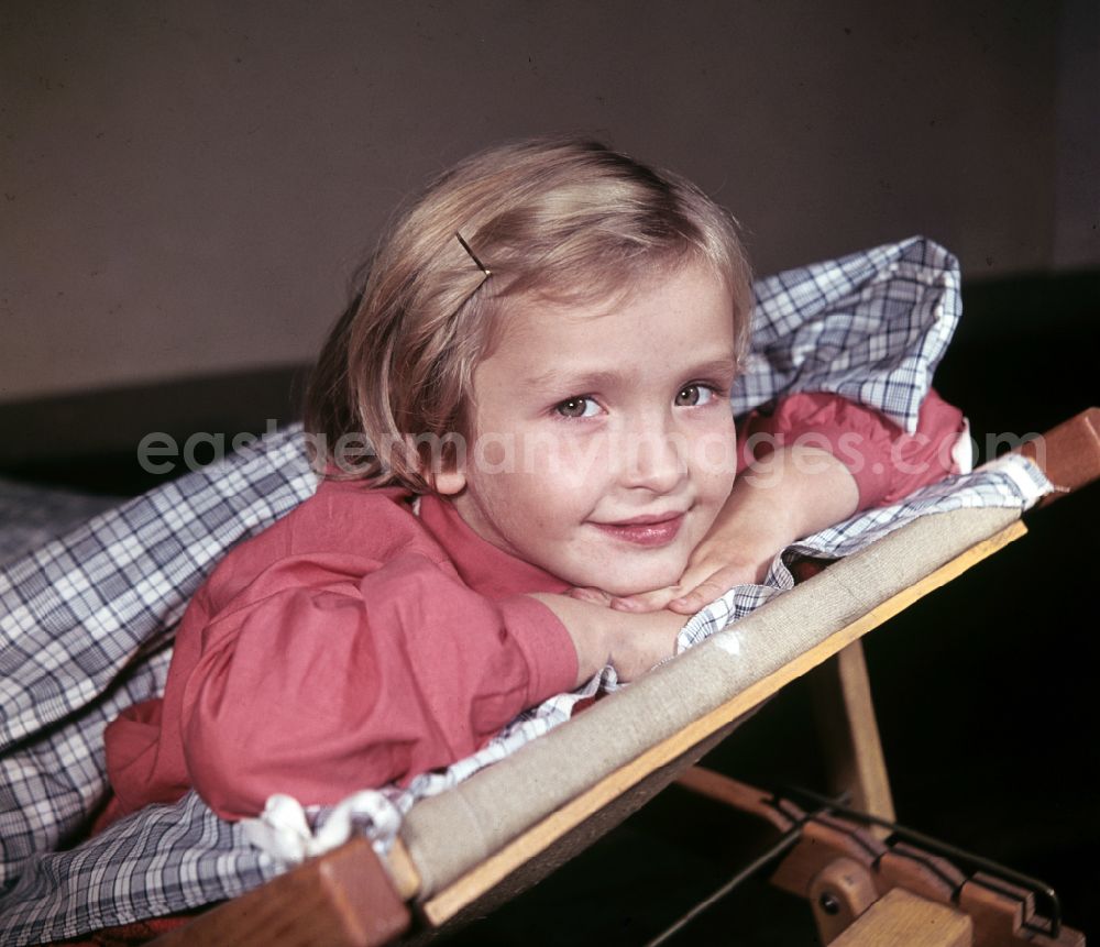 Berlin: A little girl taking a nap in the kindergarten on Michael-Brueckner-Strasse in the Schoeneweide district of Berlin in the territory of the former GDR, German Democratic Republic