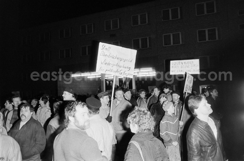 GDR photo archive: Berlin - Demonstrators and protesters during the storming and occupation the headquarters of the MfS Ministry for State Security on street Ruschestrasse - Normannenstrasse in the district Lichtenberg in Berlin Eastberlin on the territory of the former GDR, German Democratic Republic