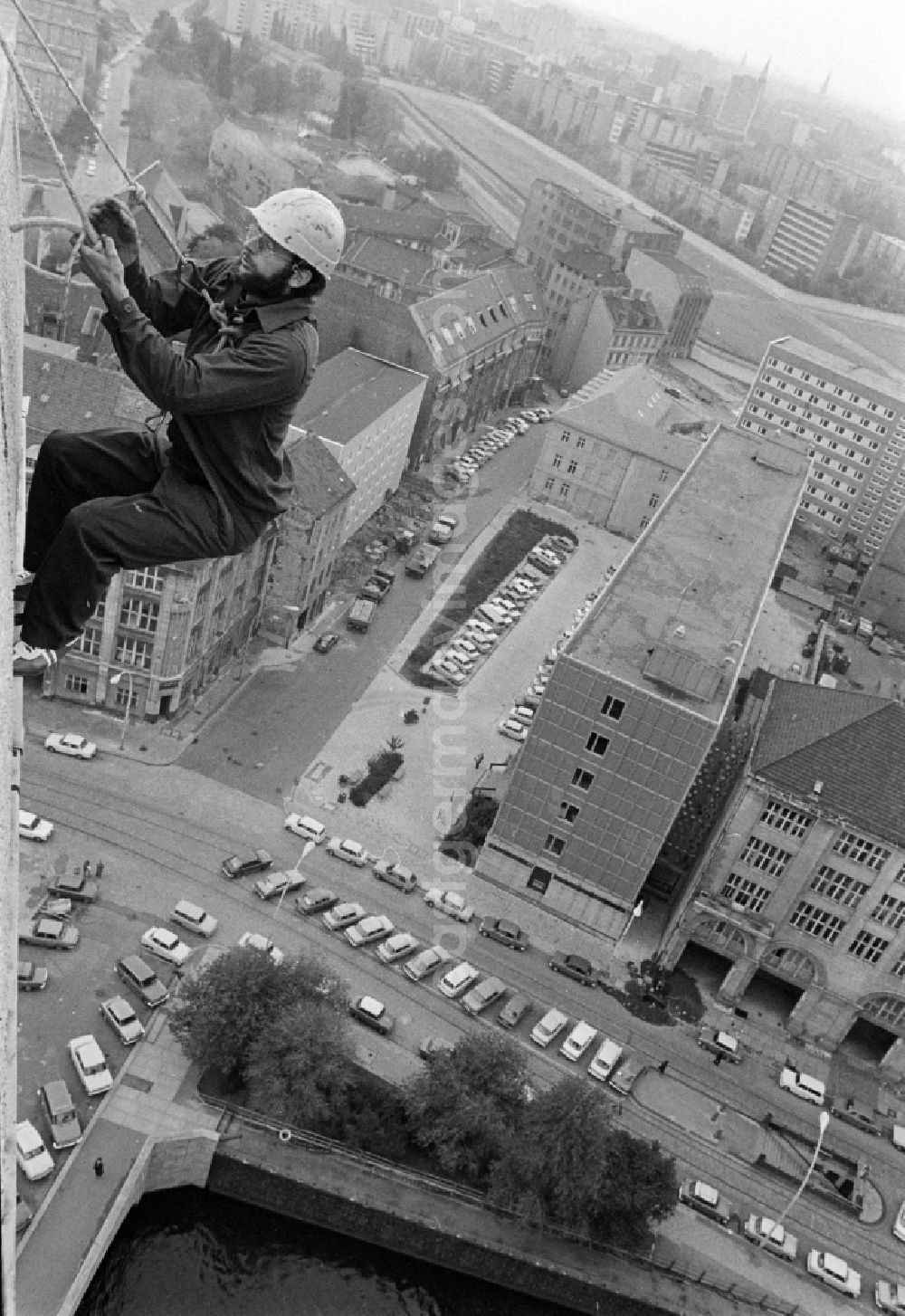 GDR photo archive: Berlin - Fire brigade rescue exercise on the facade of a residential building in Fischerinsel Street in the Mitte district of East Berlin in the territory of the former GDR, German Democratic Republic