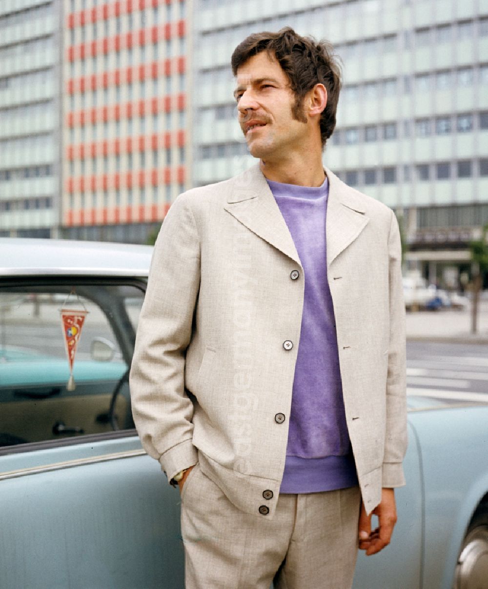 GDR picture archive: Berlin - A model presents current men's fashion - men's fashion collection in the Mitte district of Berlin East Berlin in the area of the former GDR, German Democratic Republic