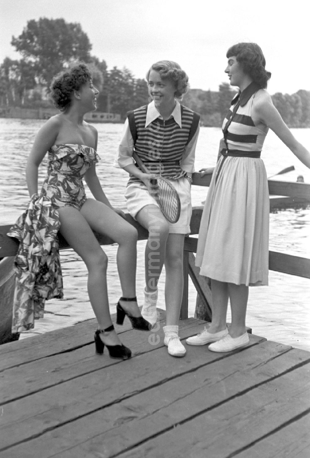 GDR picture archive: Berlin - Young people present current summer swimwear on the shore of the Rummelsburg Bay on the street Paul-und-Paula-Ufer in the district of Rummelsburg in Berlin East Berlin in the area of the former GDR, German Democratic Republic