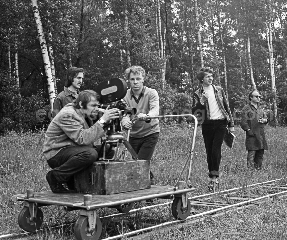 GDR picture archive: Schleife - Cameraman Franz Ritschel with director Konrad Herrmann filming on a rail car during recording and filming for Struga - Pictures of a Landscape on the road Fluss Schleife in Schleife, Saxony in the territory of the former GDR, German Democratic Republic