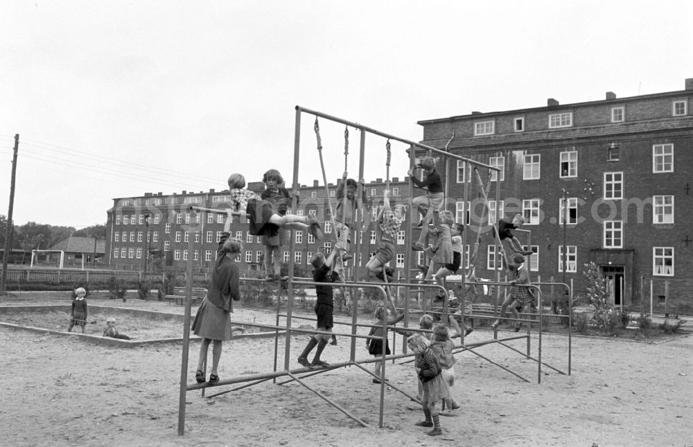 Berlin: Children on the climbing frame at a playground in Berlin East Berlin in the territory of the former GDR, German Democratic Republic