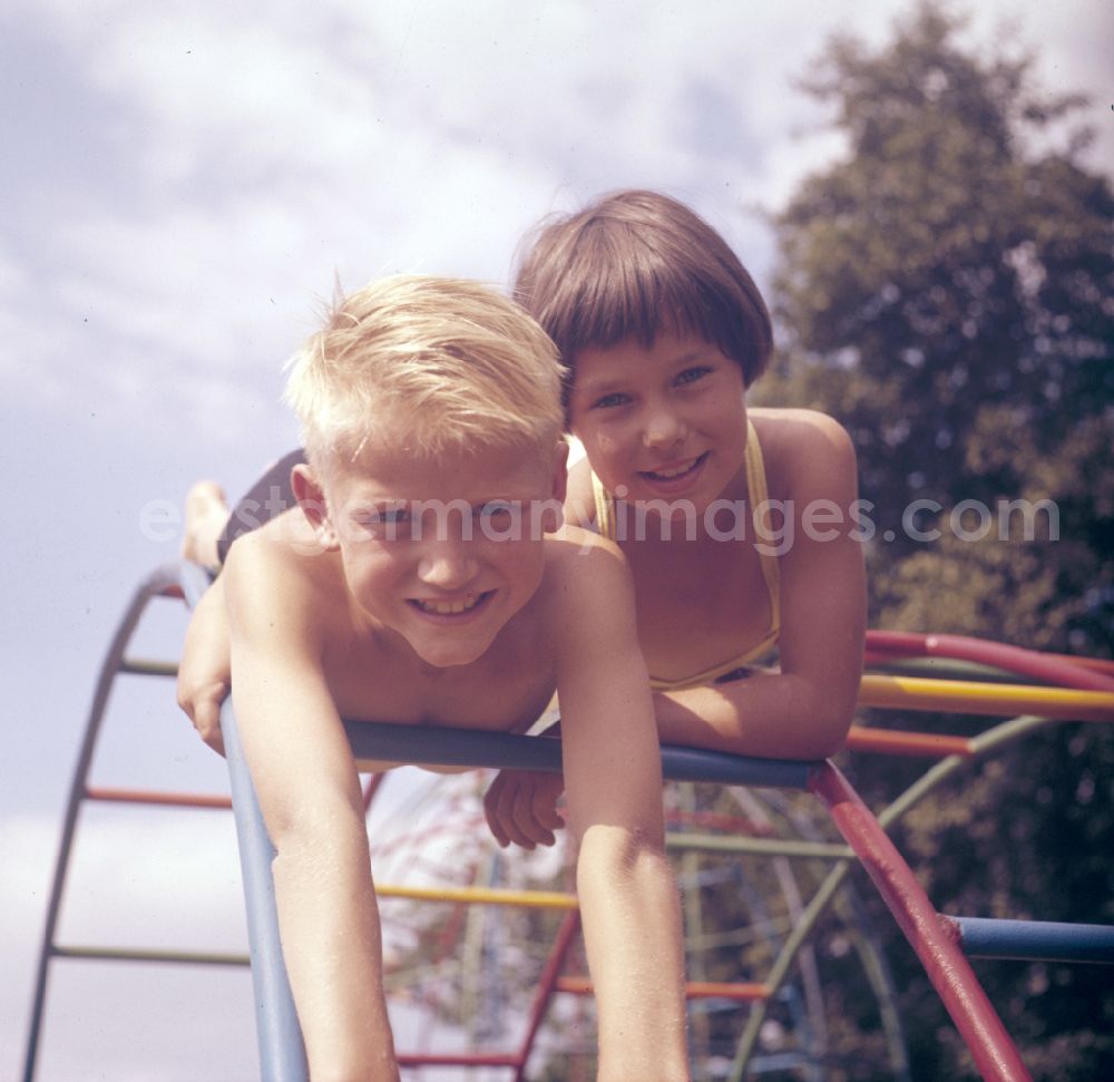 GDR photo archive: Berlin - Children on a climbing frame in the outdoor pool on the street Sportpromenade in Berlin East Berlin in the territory of the former GDR, German Democratic Republic