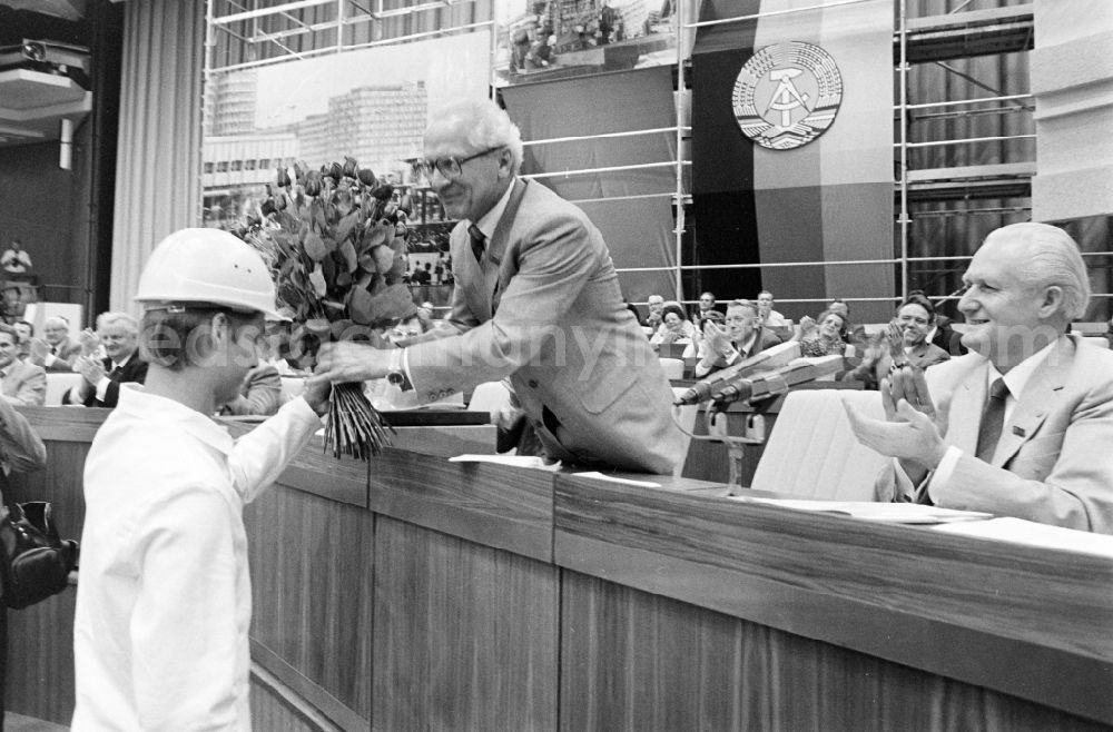 Berlin: SED - General Secretary and Chairman of the State Council receives a bouquet of flowers from a construction manager at the conference for the 7th Construction Conference in the Great Hall of the Palace of the Republic in the Mitte district of Berlin, East Berlin on the territory of the former GDR, German Democratic Republic