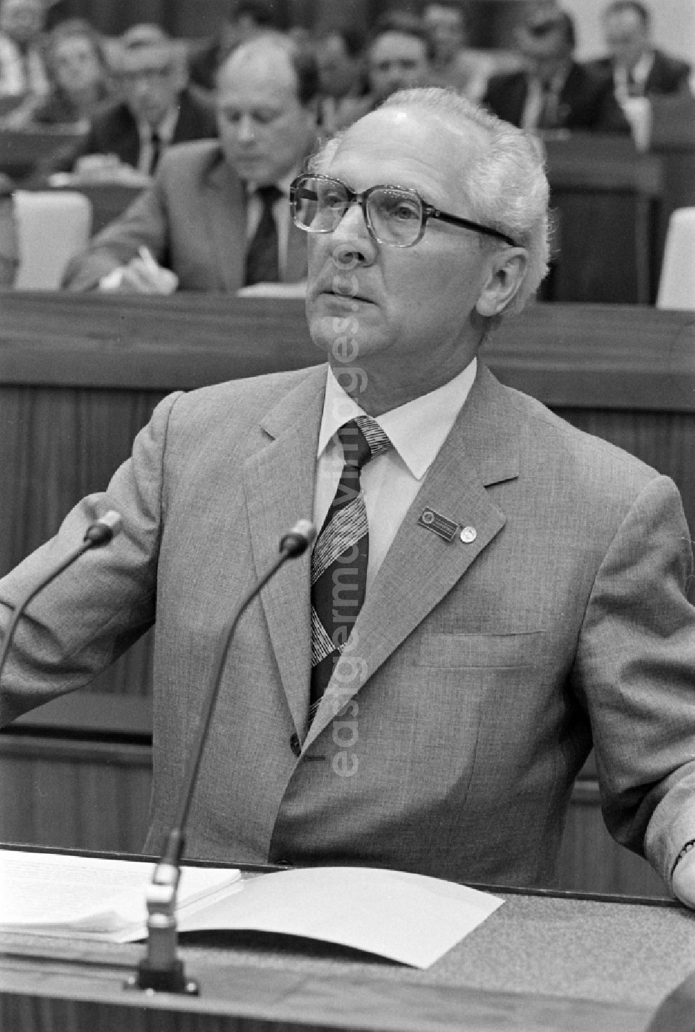 GDR picture archive: Berlin - SED - General Secretary and Chairman of the Council of State Erich Honecker as speaker before the presidium of the conference for the 7th Construction Conference in the Great Hall of the Palace of the Republic in the Mitte district of Berlin East Berlin on the territory of the former GDR, German Democratic Republic