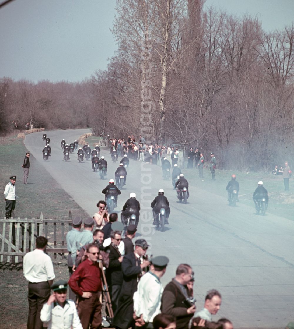 GDR photo archive: Hohenstein-Ernstthal - Drivers and spectators during the motorcycle race at the Sachsenring in Hohenstein-Ernstthal, Saxony in the territory of the former GDR, German Democratic Republic