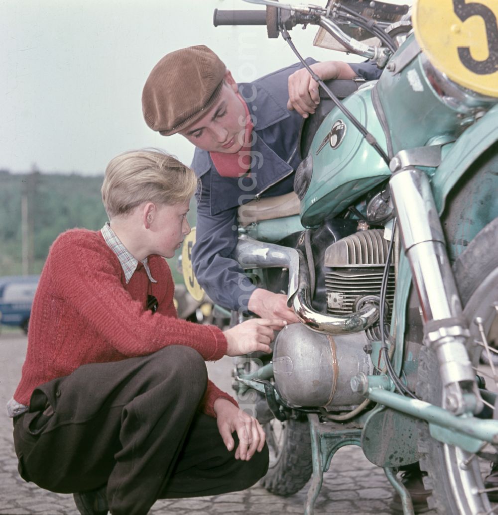 GDR picture archive: Hohenstein-Ernstthal - Checking a participating MZ motorcycle before the race at the Sachsenring in Hohenstein-Ernstthal, Saxony in the territory of the former GDR, German Democratic Republic