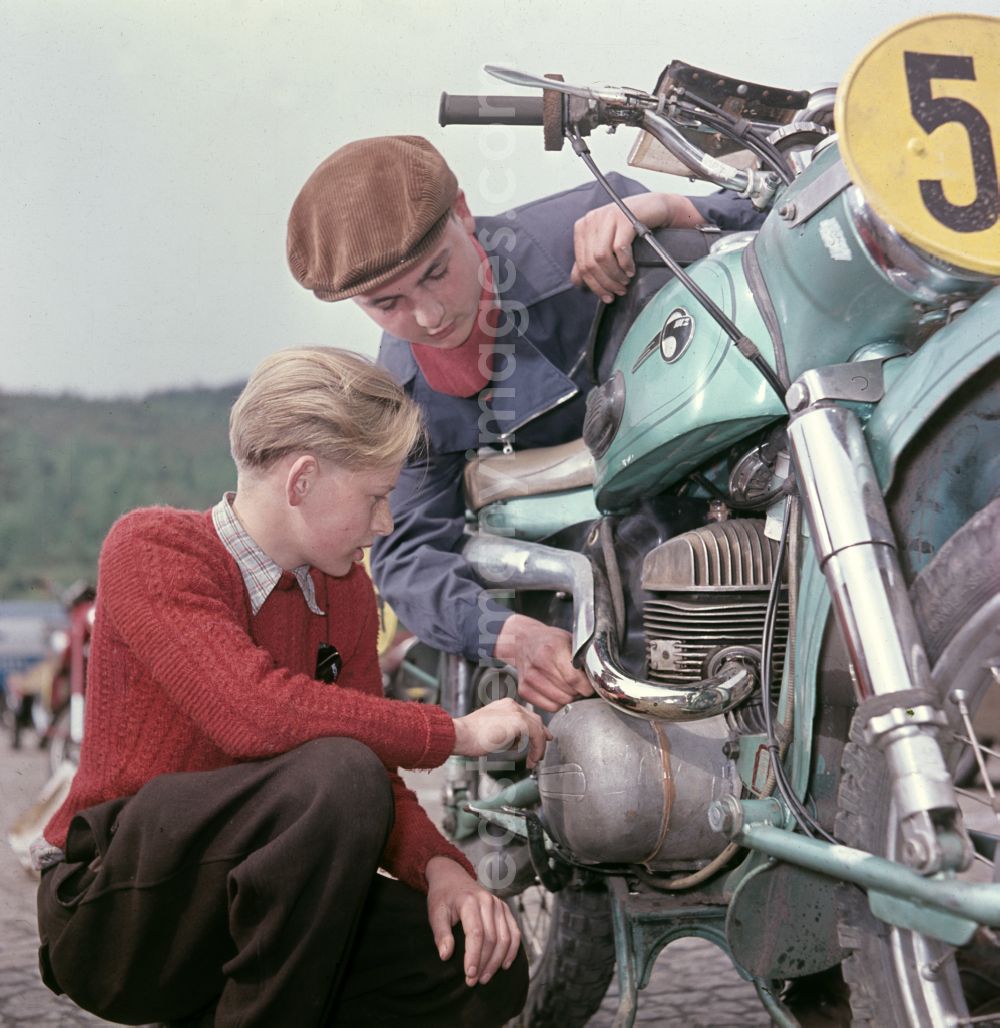 Hohenstein-Ernstthal: Checking a participating MZ motorcycle before the race at the Sachsenring in Hohenstein-Ernstthal, Saxony in the territory of the former GDR, German Democratic Republic