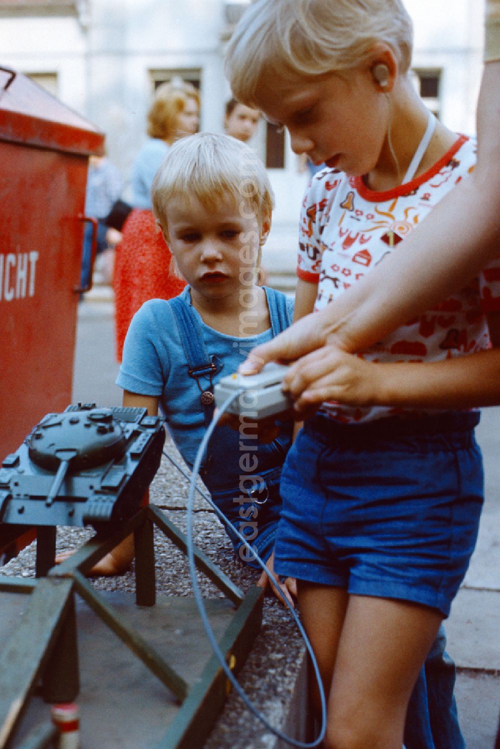 Berlin: Boy plays with a toy tank at the Pankefest in East Berlin on the territory of the former GDR, German Democratic Republic