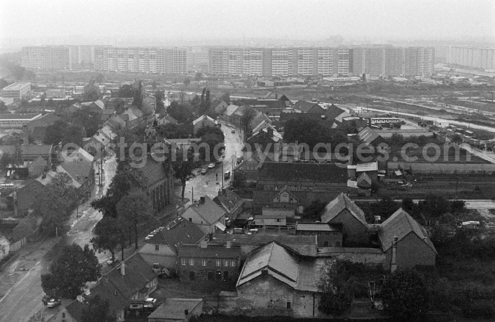 Berlin: Village center of Alt-Marzahn in front of the facades of an industrially manufactured prefabricated housing estate in the district of Marzahn in Berlin East Berlin in the area of the former GDR, German Democratic Republic