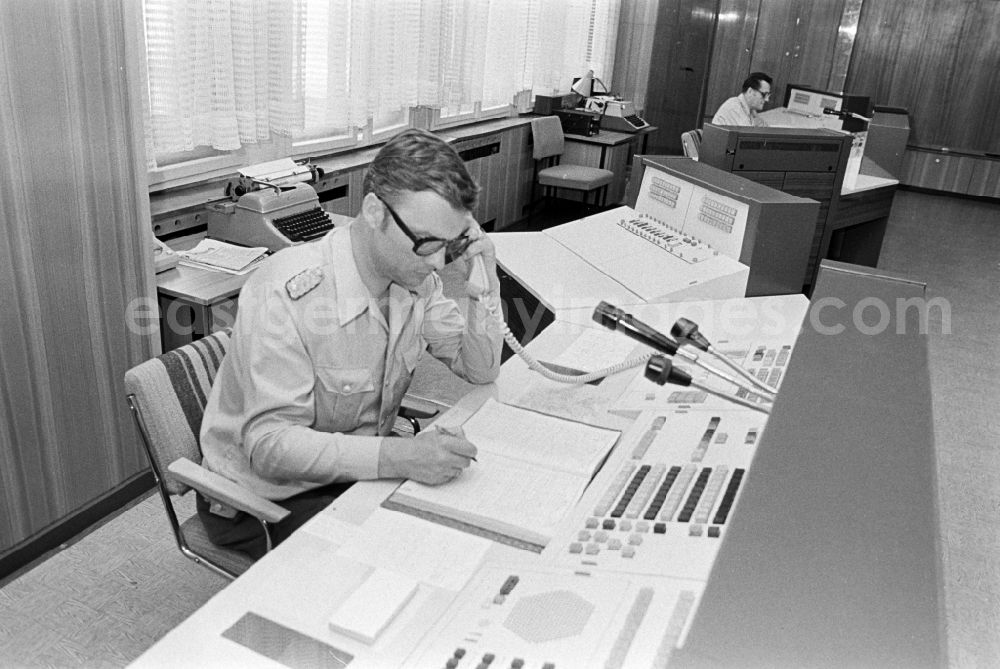 GDR picture archive: Berlin - Police officer in uniformin Uniform der Deutschen Volkspolizei im Lagezentrum on street Keibelstrasse in the district Mitte in Berlin Eastberlin on the territory of the former GDR, German Democratic Republic