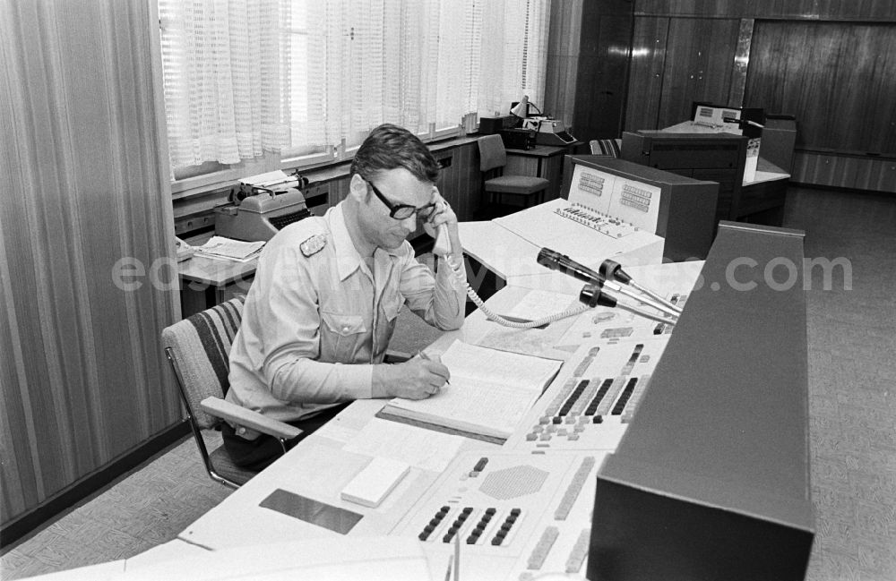 GDR image archive: Berlin - Police officer in uniformin Uniform der Deutschen Volkspolizei im Lagezentrum on street Keibelstrasse in the district Mitte in Berlin Eastberlin on the territory of the former GDR, German Democratic Republic