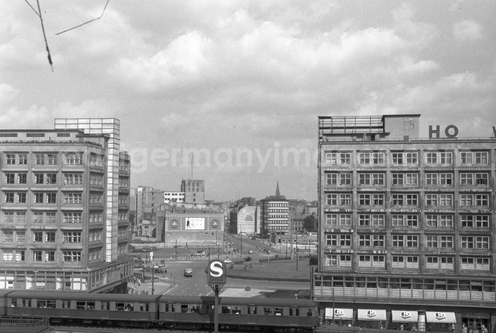 GDR photo archive: Berlin - Road traffic and road conditions at the Alexanderhaus and the Berolinahaus in the area of the Alexanderplatz S-Bahn station in the Mitte district of Berlin East Berlin in the area of the former GDR, German Democratic Republic