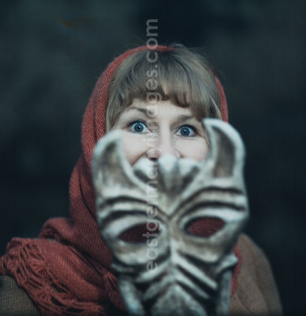 GDR photo archive: Bautzen - Scene from the film and television production Continent of Hope in Bautzen, Saxony in the area of the former GDR, German Democratic Republic. The actress Majka Kowarjec with an animal mask