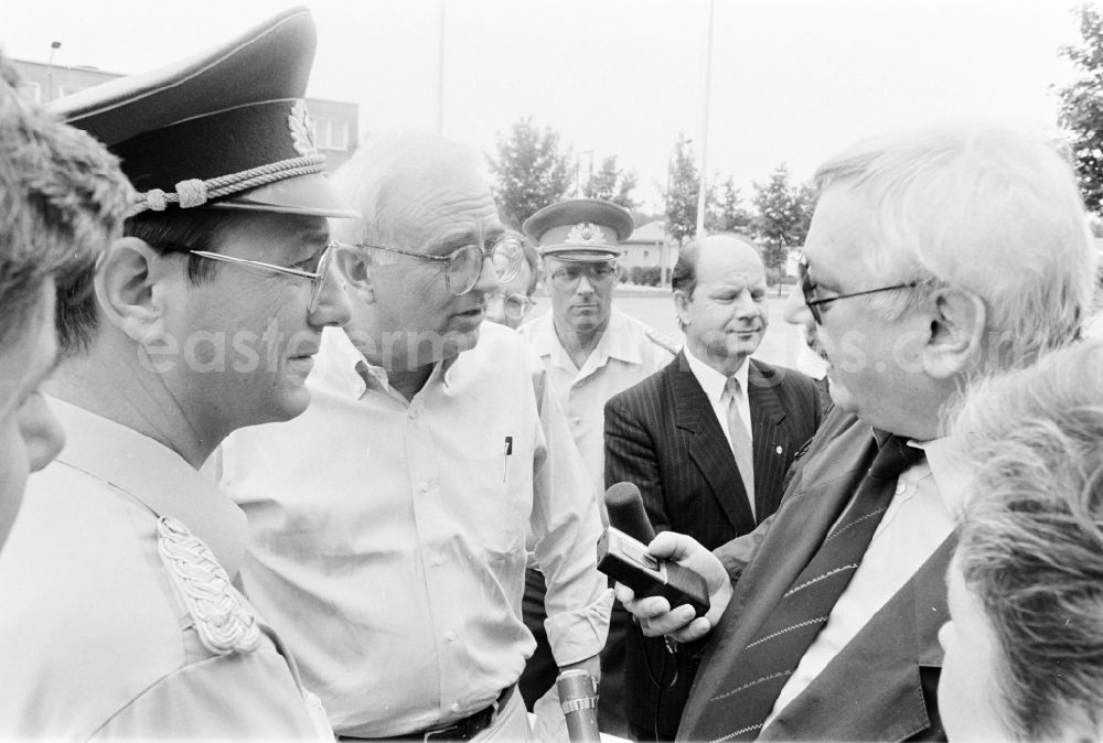 GDR photo archive: Oranienburg - Wolfgang Herger, head of the security affairs department at the Central Committee of the SED at a meeting in the NVA National People's Army office on the occasion of a troop visit by American army personnel and military observers in the radio relay regiment-2 Konrad Wolf (RiFuR-2) in Oranienburg, Brandenburg in the territory of the former GDR, German Democratic Republic