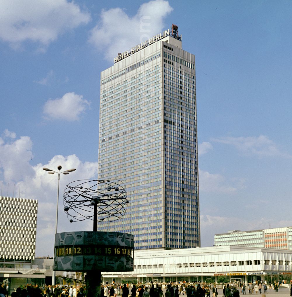 GDR picture archive: Berlin - Tourist attraction and landmark World Time Clock in the background Hotel Stadt Berlin at Alexanderplatz in the Mitte district of Berlin East Berlin in the territory of the former GDR, German Democratic Republic