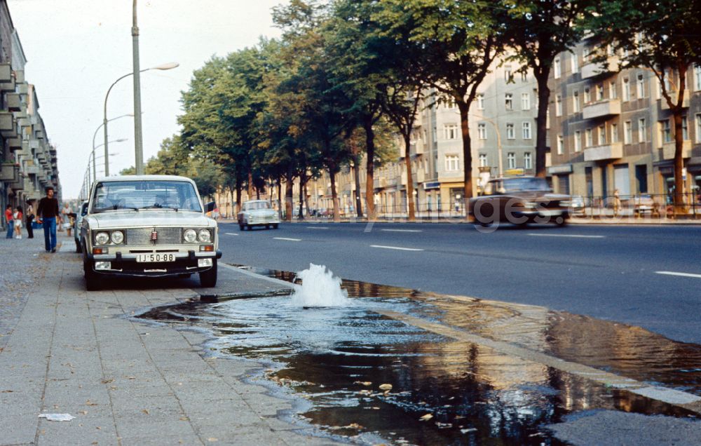 GDR image archive: Berlin - Water bubbles out of a pipe on Bornholmer Strasse in East Berlin in the territory of the former GDR, German Democratic Republic