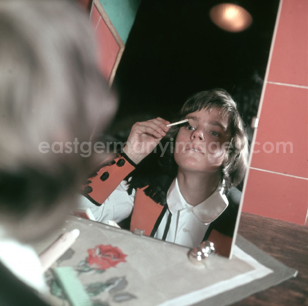 GDR image archive: Berlin - Young artist combing his hair in front of the mirror in preparation for his performance at the Circus Busch in East Berlin, part of the former GDR, German Democratic Republic