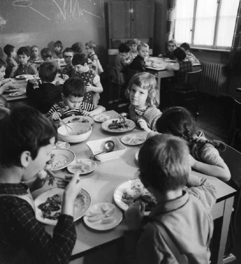 Common lunch at the child home in Bad Belzig in the federal state Brandenburg in the area of the former GDR, German democratic republic