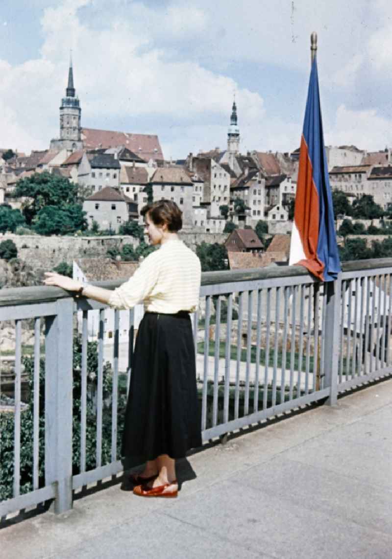 Woman on bridge on historic old town in the center in Bautzen in the state Saxony on the territory of the former GDR, German Democratic Republic