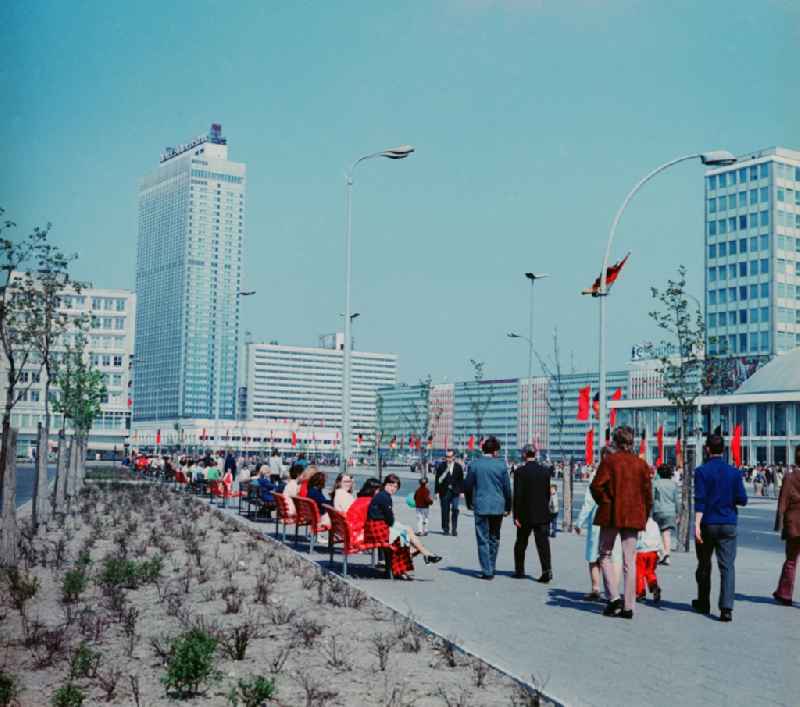View in the direction of the Berliner Verlag decorated with flags Alexander street in Berlin. On the left is the Hotel Stadt Berlin