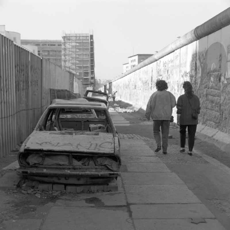 Wrecked car parked at the Berlin Wall in Berlin