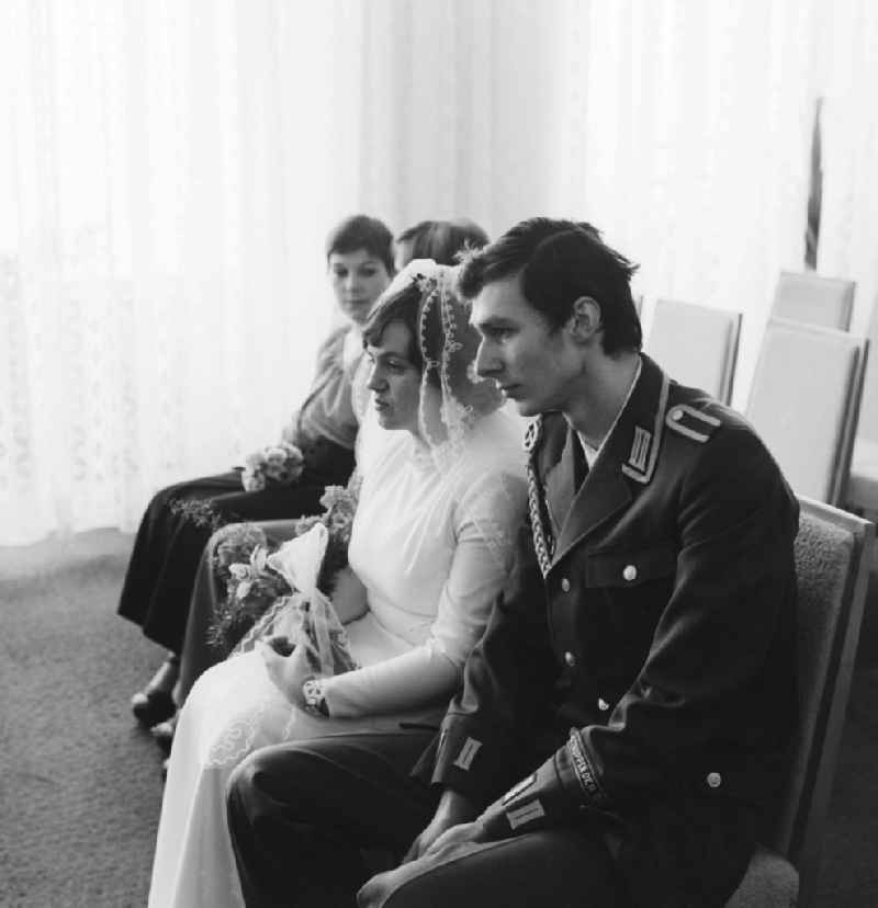 Wedding couple in the registry office in Berlin, the former capital of the GDR, the German Democratic Republic