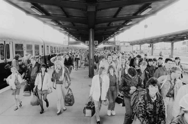 Arrival of participants to the Pentecost meeting of youth at the Lichtenberg station in Berlin, the former capital of the GDR, the German Democratic Republic