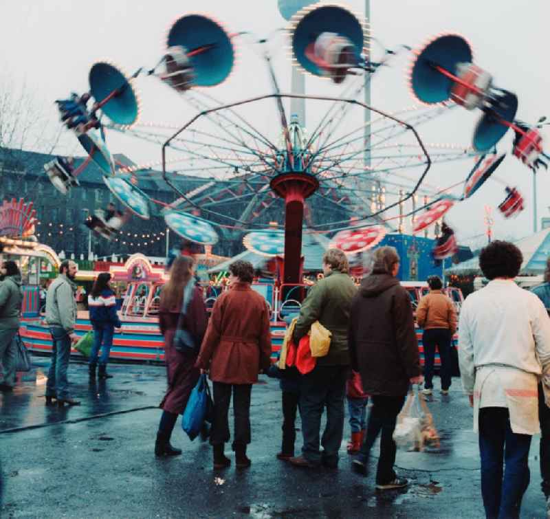Rides and visitors at the Christmas Market in Berlin, the former capital of the GDR, German Democratic Republic