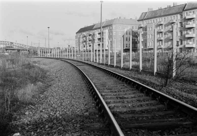 Former course of the Wall at the S-Bahn station Bornholmer Strasse with view towards the center and the TV tower in Berlin - Prenzlauer Berg, the former capital of the GDR, German Democratic Republic