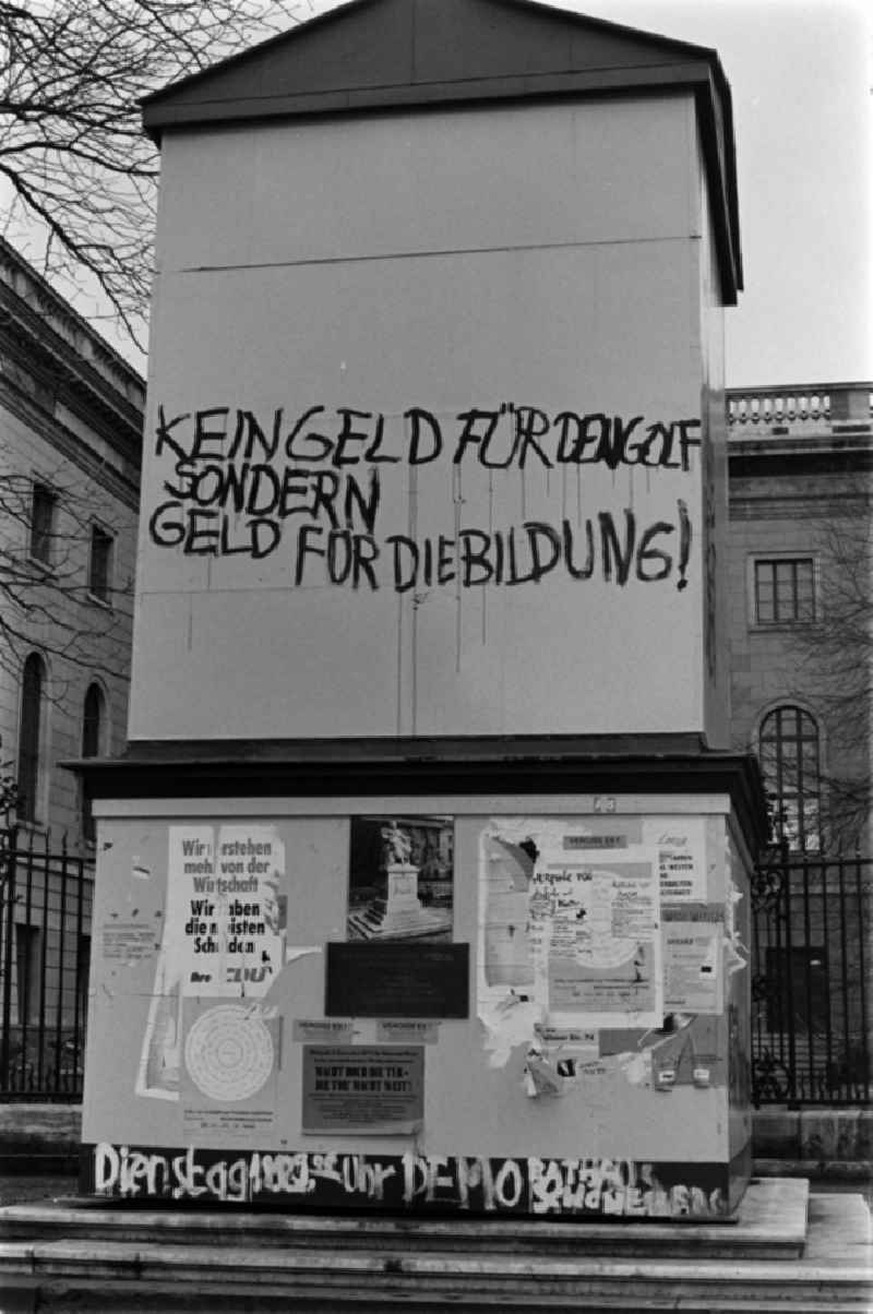The words 'No money for the Golf, but money for education' stands at the winter enclosure of the Humboldt Monument during the protest against the transaction of the Humboldt University in Berlin - Mitte, the former capital of the GDR, German Democratic Republic