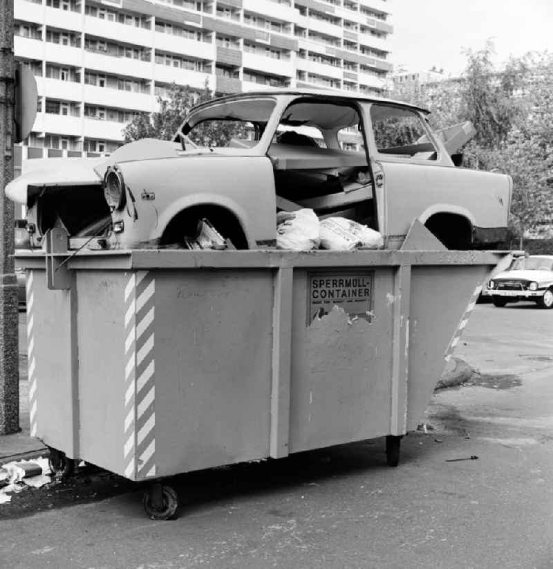 A Trabant was disposed of in a bulky waste container on the side of a road in Berlin - Mitte