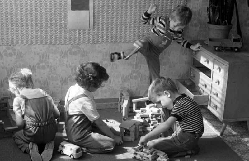 Boys playing with building blocks in a kindergarten in Berlin Eastberlin on the territory of the former GDR, German Democratic Republic
