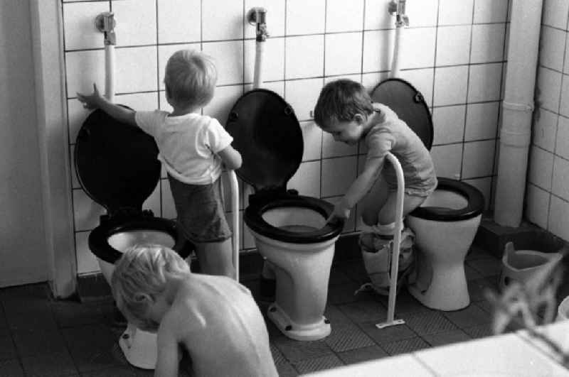 Toddlers go to the lavatory together in a day nursery in Berlin Eastberlin on the territory of the former GDR, German Democratic Republic
