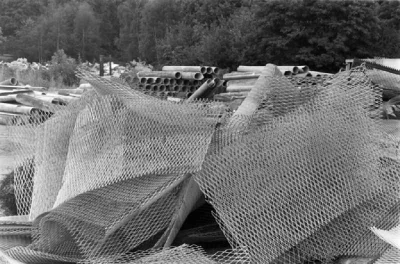 Fragments of the decaying expanded metal barriers of the border fortifications and wall as well as security structures in the former border strip of the state border on a camp site of the border troops in the district of Steinstuecken in Berlin on the territory of the former GDR, German Democratic Republic
