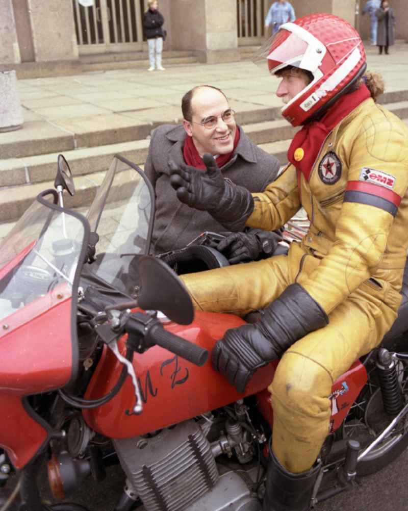 PDS - left - politician Gregor Gysi drives with the sidecar of an MZ - motorcycle in front of the entrance of the former Central Committee of the SED and headquarters of the PDS (today's Foreign Office - Ministry of Foreign Affairs) in the district Mitte in Berlin East Berlin in the area of the former GDR, German Democratic Republic