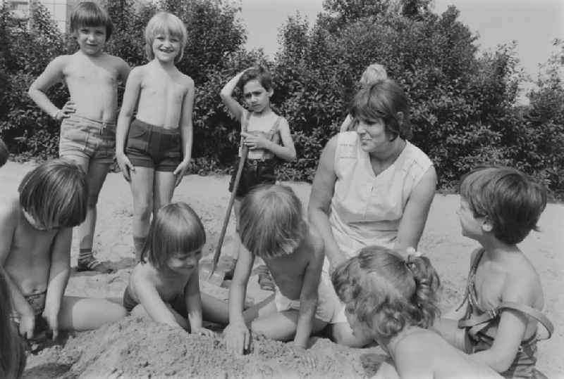 Play and fun with small children supervised by a teacher in a kindergarten in Rosenfelder Ring in Berlin East Berlin in the area of the former GDR, German Democratic Republic