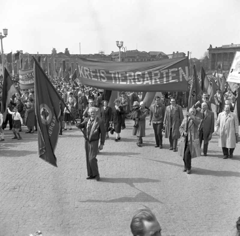 Workers from West Berlin taking part in the May 1st demonstrations with the banner 'Kreis Tiergarten' on the streets of the city center at Schlossplatz - Marx-Engels-Platz - Lustgarten in the Mitte district of Berlin, East Berlin on the territory of the former GDR, German Democratic Republic