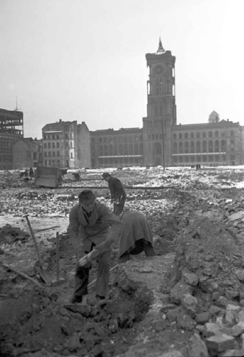 Men and women clearing rubble and cleaning up in front of the Red Town Hall in East Berlin in the territory of the former GDR, German Democratic Republic