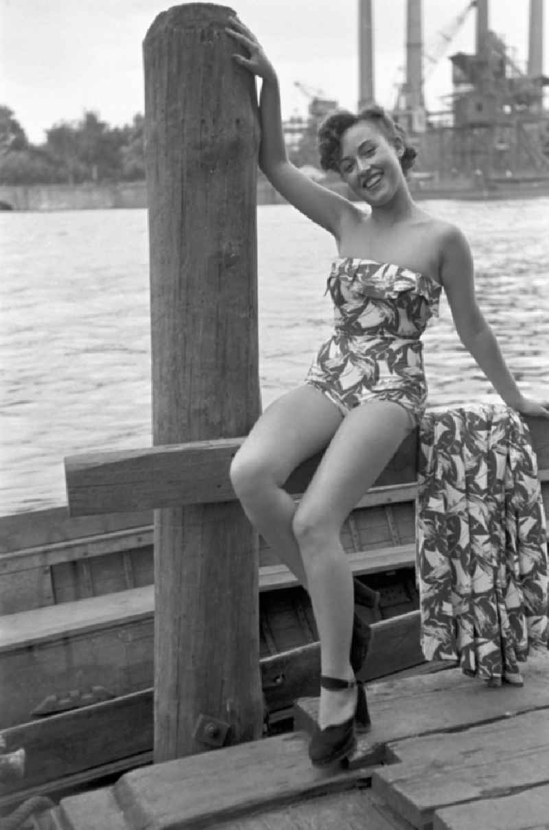 Young people present current summer swimwear on the shore of the Rummelsburg Bay on the street Paul-und-Paula-Ufer in the district of Rummelsburg in Berlin East Berlin in the area of the former GDR, German Democratic Republic